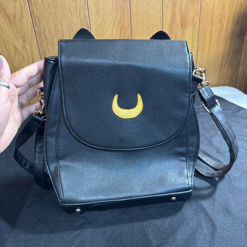Black and gold Sailor Moon backpack